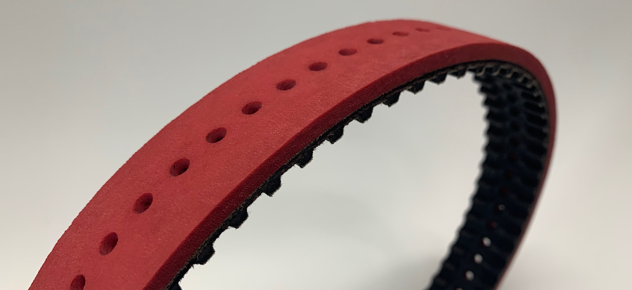 Neoprene timing belts with Linatex coating and perforaties